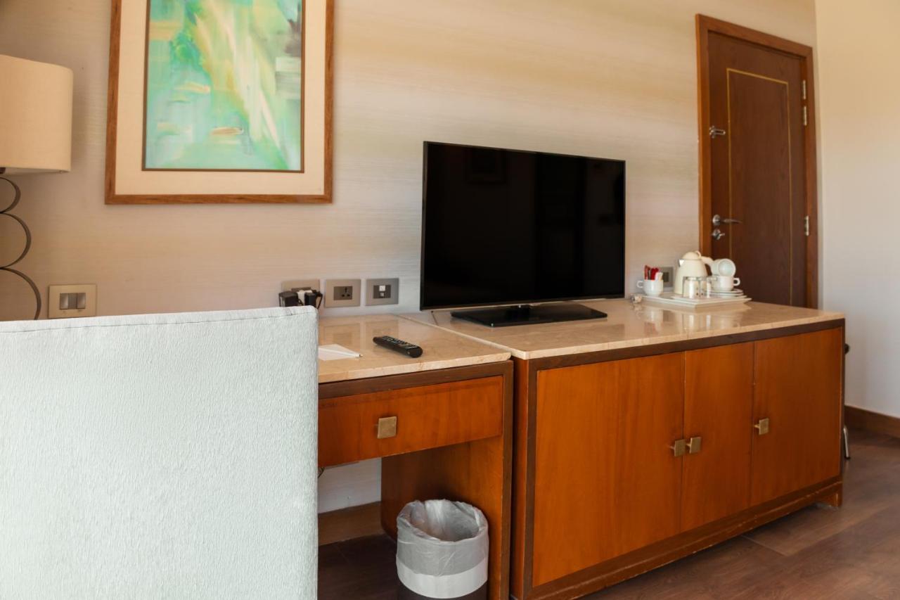 Sharm Dreams Vacation Club - Aqua Park Hotell Eksteriør bilde A television in a hotel room